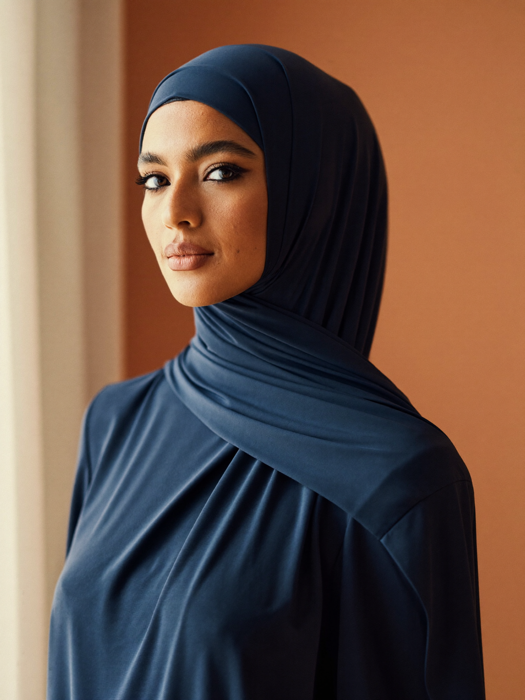 Signature Jersey Hijab worn by Amina, navy