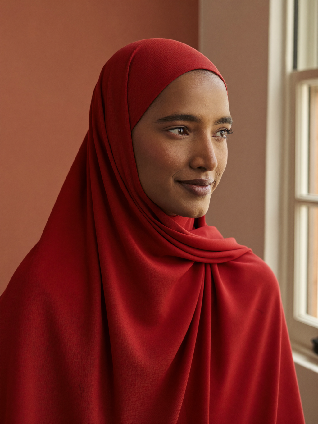 Signature Jersey Hijab worn by Fatima, red