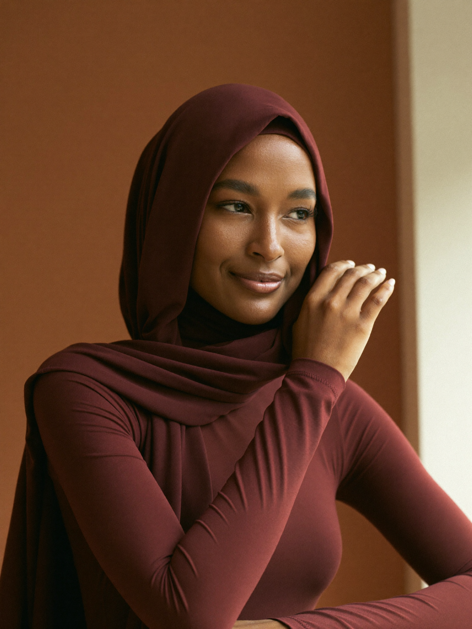Signature Jersey Hijab worn by Fatima, burgundy