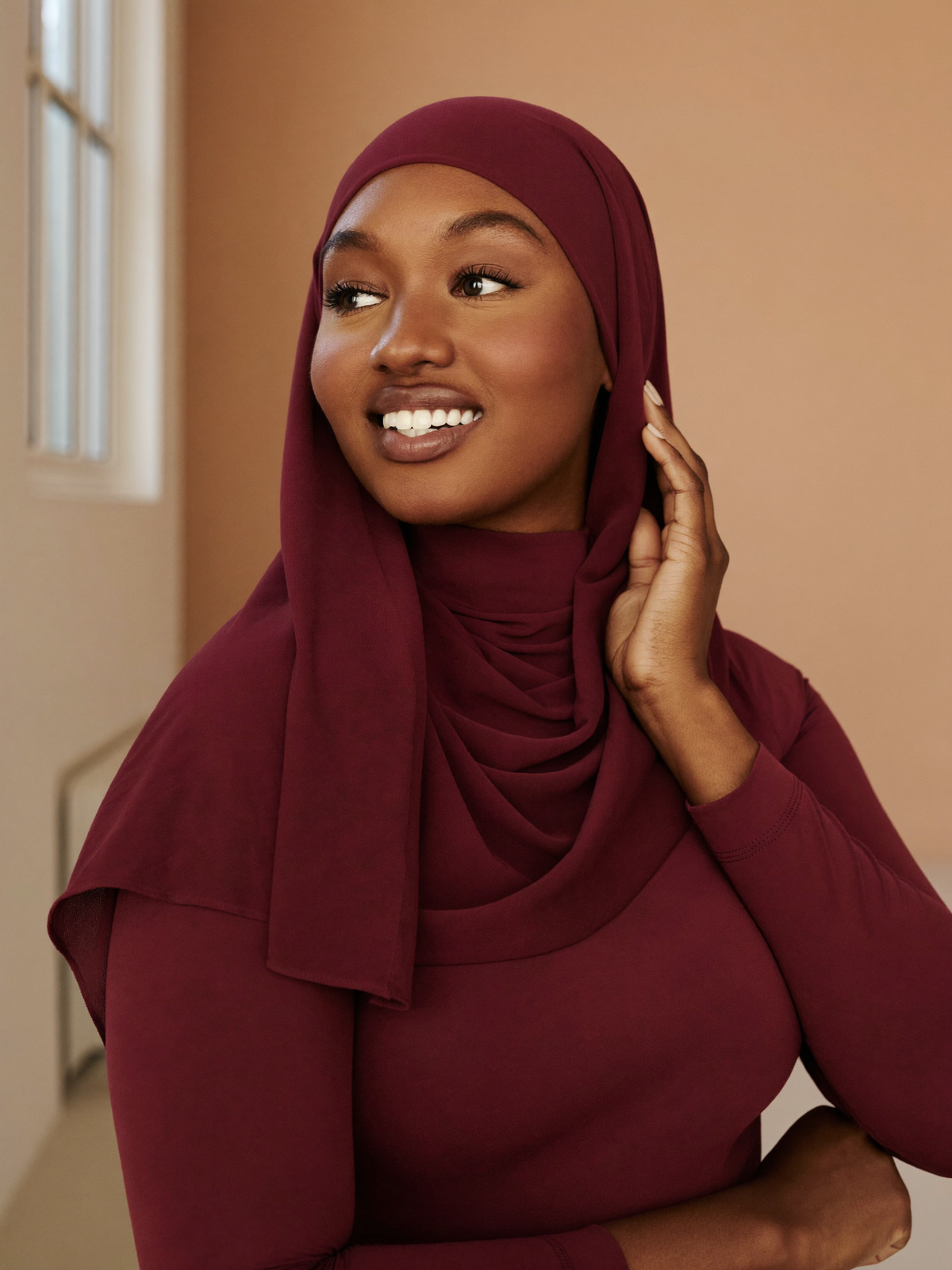 Signature Jersey Hijab worn by Khadija, burgundy