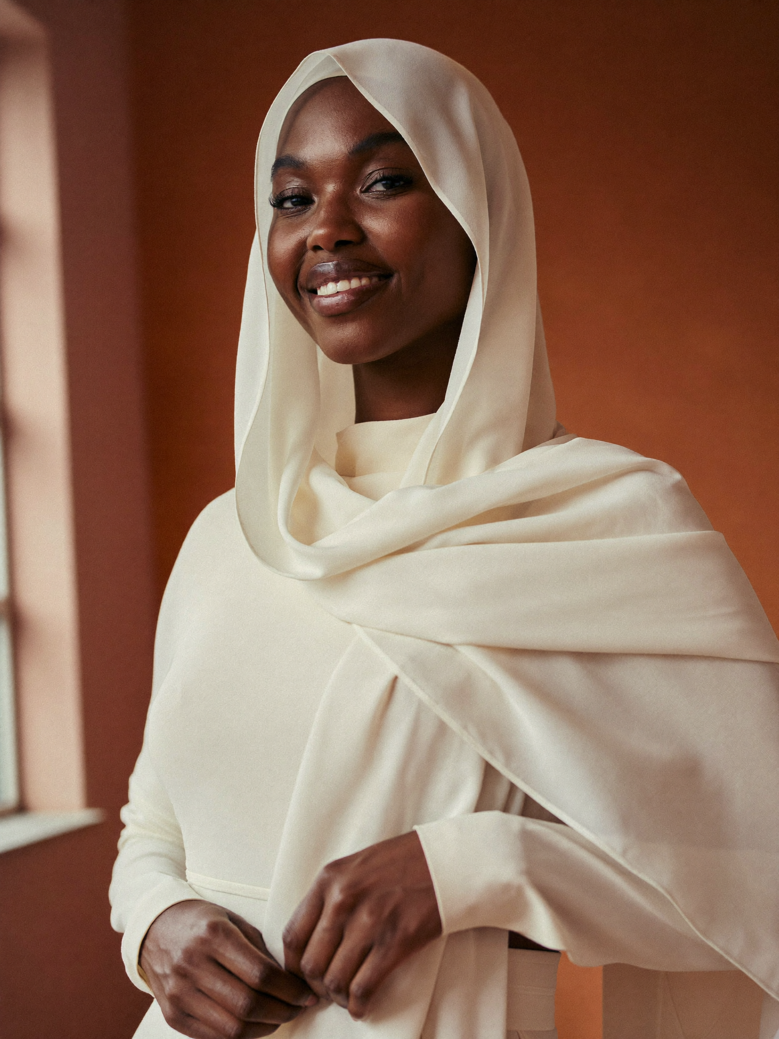 Pleated rayon scarf + bucket hat combo worn by Khadija